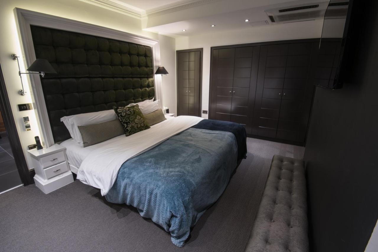 더 익스비셔니스트 호텔 바이 더키컬렉션 런던 외부 사진 A bedroom at the hotel